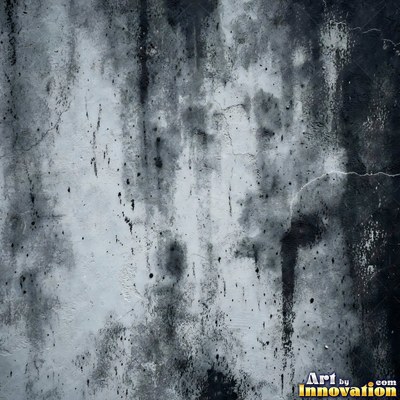 Blackened grunge wall with dried paint splatter filling the frame