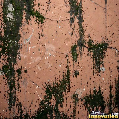 Old blue gray wall built up in layers of patched plaster and paint