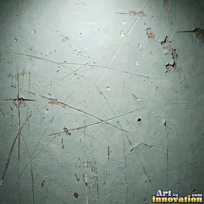 Blackened grunge wall with dried paint splatter filling the frame