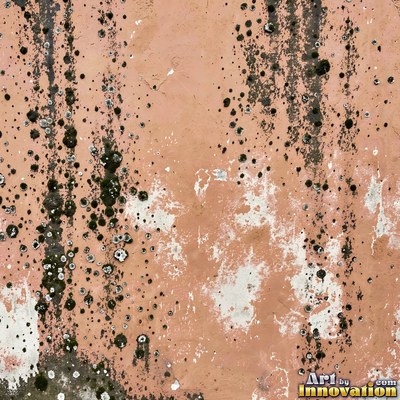 Smoke stained ochre wall with dark soot gradients across the surface