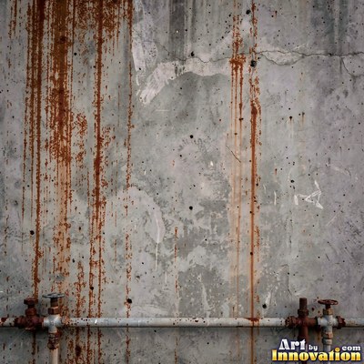 Blackened grunge wall with dried paint splatter filling the frame