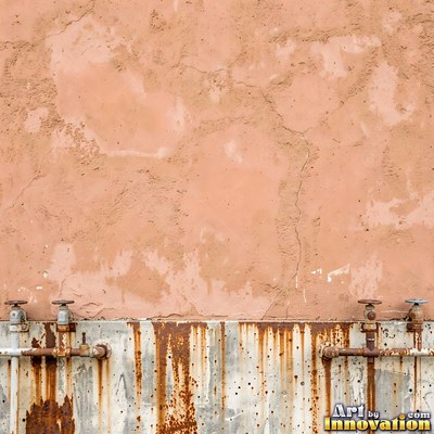 Old blue gray wall built up in layers of patched plaster and paint