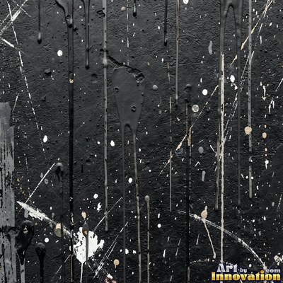 Blackened grunge wall with dried paint splatter filling the frame