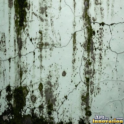 Smoke stained ochre wall with dark soot gradients across the surface
