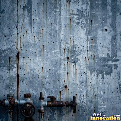 Grungy beige wall splattered with old paint drips, shot flat and even
