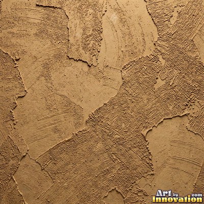 Rough sand textured stucco in warm beige under even front light