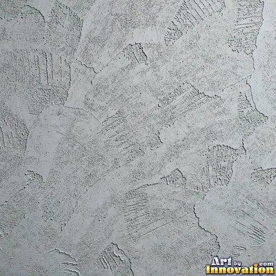 Swirled plaster ceiling pattern of overlapping circles in cool gray