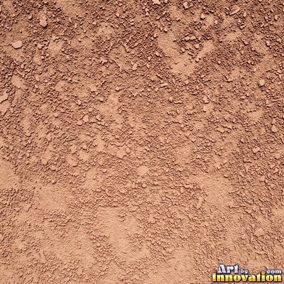 Rough sand textured stucco in warm beige under even front light