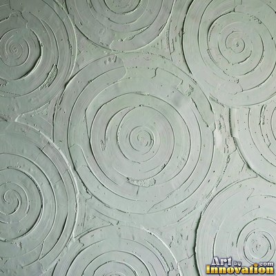 Cracked plaster with fine spidery lines in faded mint green paint