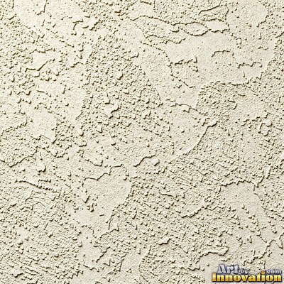 Rough sand textured stucco in warm beige under even front light