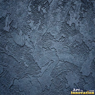 Rough sand textured stucco in warm beige under even front light