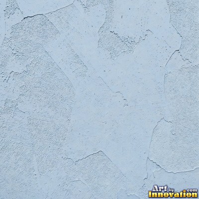 Rough sand textured stucco in warm beige under even front light