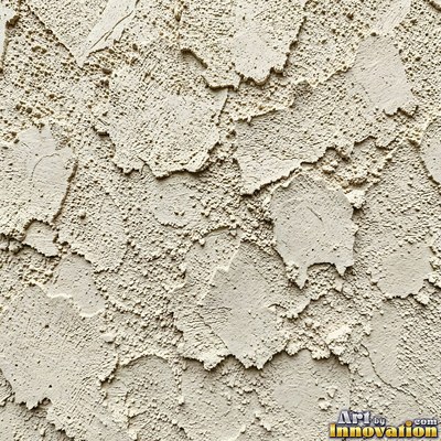 Cracked plaster with fine spidery lines in faded mint green paint