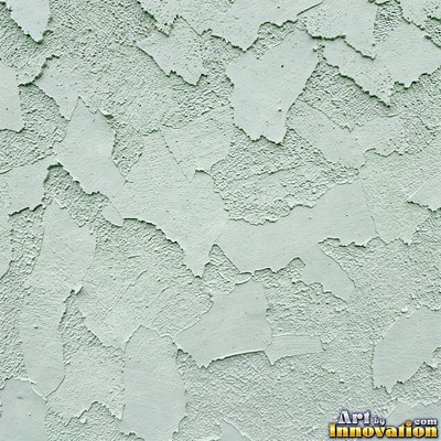 Swirled plaster ceiling pattern of overlapping circles in cool gray