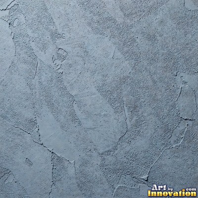 Rough sand textured stucco in warm beige under even front light