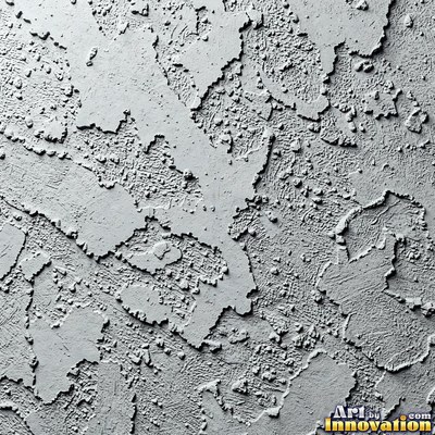 Cracked plaster with fine spidery lines in faded mint green paint