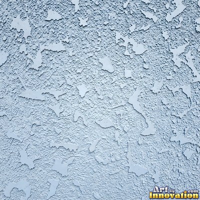 Swirled plaster ceiling pattern of overlapping circles in cool gray