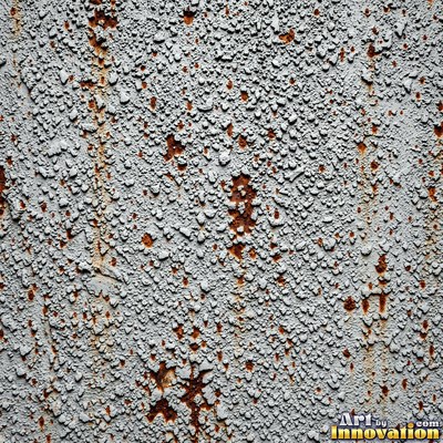 Cracked plaster with fine spidery lines in faded mint green paint