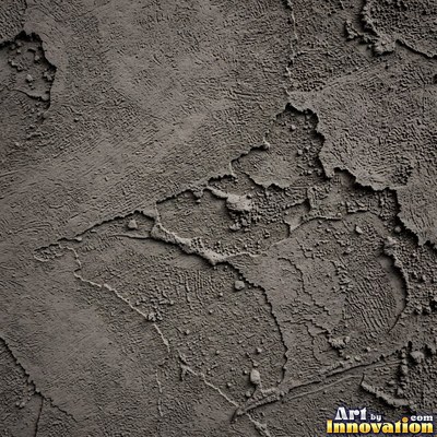 Cracked plaster with fine spidery lines in faded mint green paint
