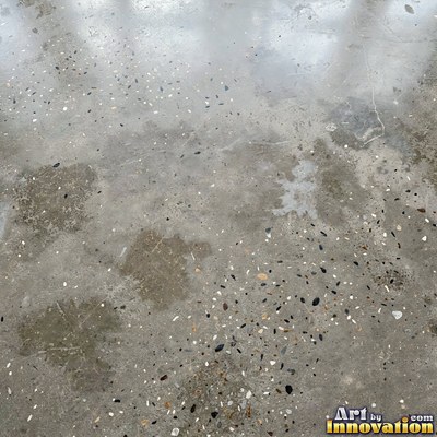 Gray concrete slab with a fine hairline crack running across it