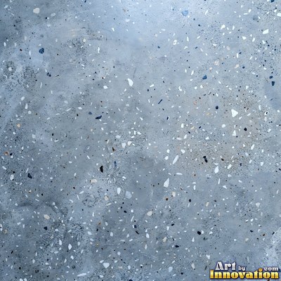 Smooth raw concrete with small air holes scattered across the surface