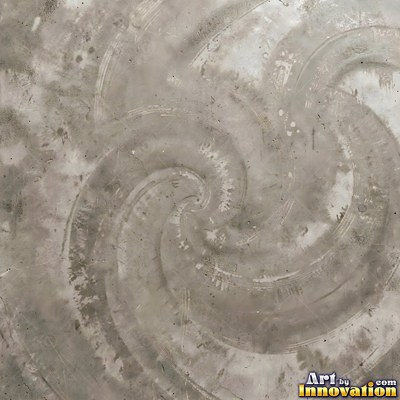 Smooth raw concrete with small air holes scattered across the surface
