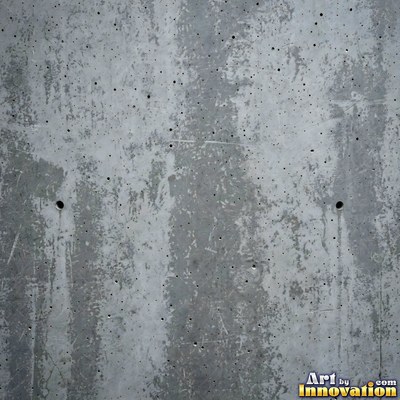Smooth raw concrete with small air holes scattered across the surface