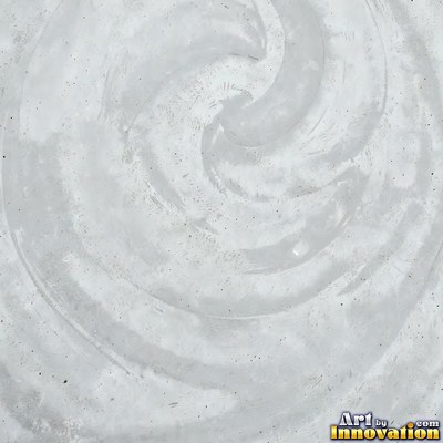 Smooth raw concrete with small air holes scattered across the surface