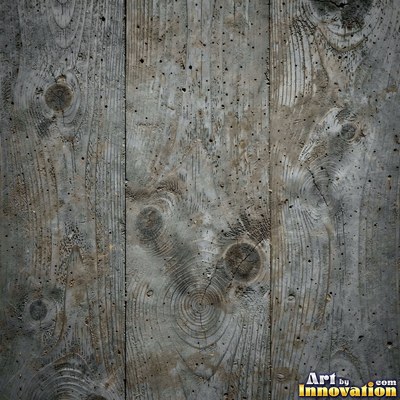 Smooth raw concrete with small air holes scattered across the surface