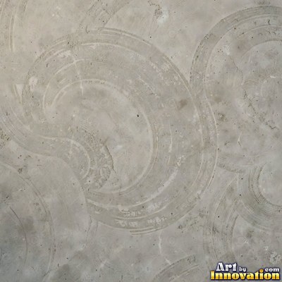 Smooth raw concrete with small air holes scattered across the surface