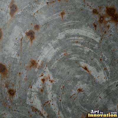 Smooth raw concrete with small air holes scattered across the surface