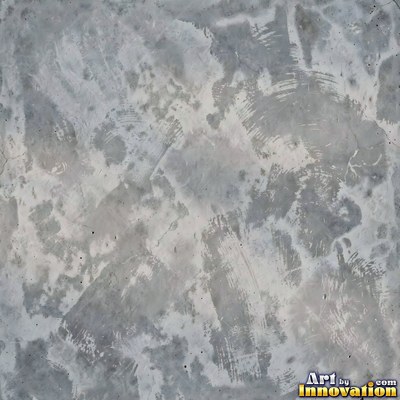 Smooth raw concrete with small air holes scattered across the surface