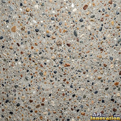 Smooth raw concrete with small air holes scattered across the surface