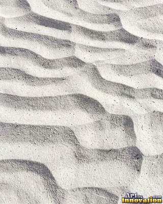 White coral sand dune surface with soft shadowed ridges
