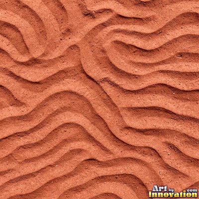 Dry cracked sand crust in rust red clay tones