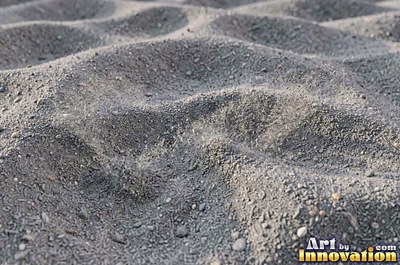 White coral sand dune surface with soft shadowed ridges