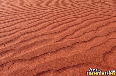 White coral sand dune surface with soft shadowed ridges