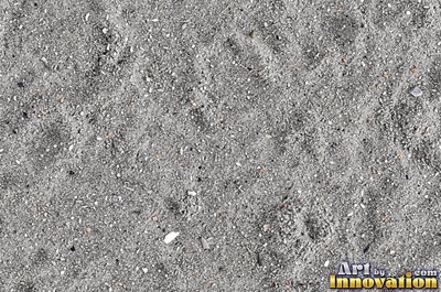 Pink sand marked with small swirls carved by the wind