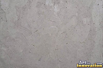 Dry cracked mud broken into polygon shaped plates of clay brown