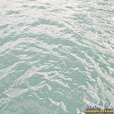 Concentric ripples spreading from a single drop on teal water