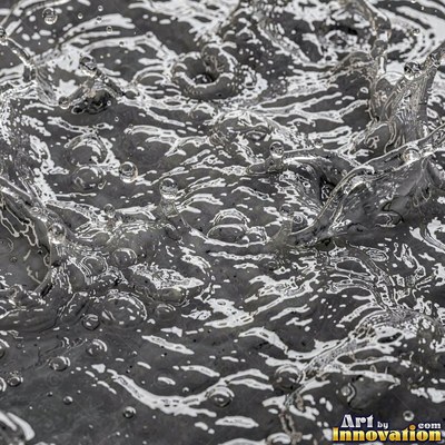 Rain drops hitting a water surface in crystal clear tones