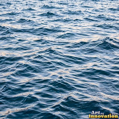Rain drops hitting a water surface in crystal clear tones