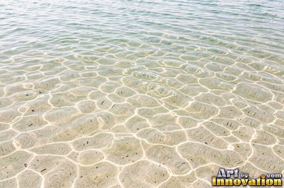 Rain drops hitting a water surface in crystal clear tones