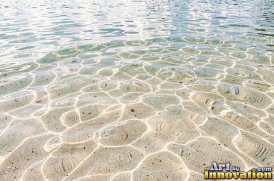 Rain drops hitting a water surface in crystal clear tones