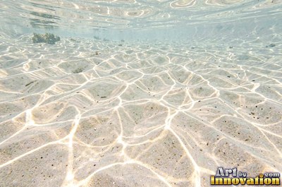 Rain drops hitting a water surface in crystal clear tones