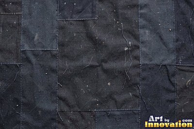 Acid washed denim with marbled bleach patterns, shot flat and even