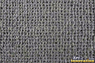 Chunky garter stitch in thick black wool, a full frame knit texture