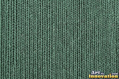 Basket weave knit stitch pattern in teal yarn
