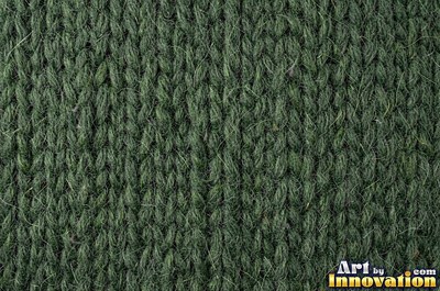 Chunky garter stitch in thick black wool, a full frame knit texture