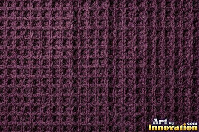Deep burgundy waffle knit with square pockets under even light